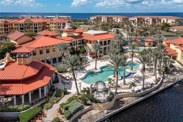 birds eye view of property featuring a residential view and a water view