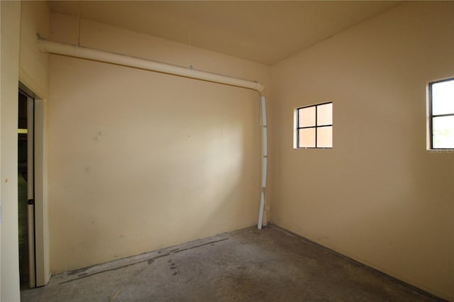 spare room with concrete floors