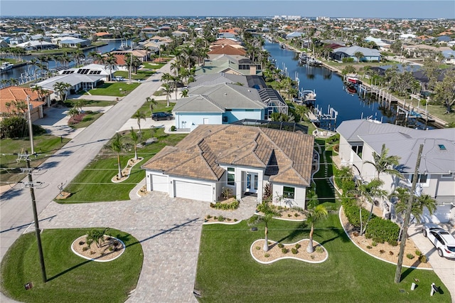 aerial view featuring a residential view and a water view