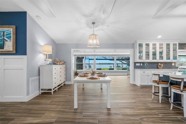 dining area with visible vents and wood tiled floor