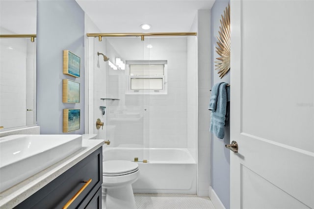 bathroom featuring toilet, shower / bath combination with glass door, tile patterned flooring, and vanity