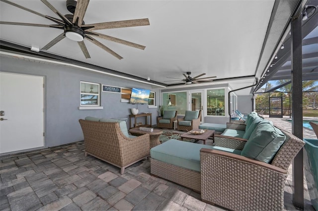 sunroom with ceiling fan