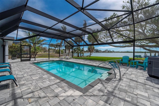 pool featuring a water view, a patio area, and glass enclosure