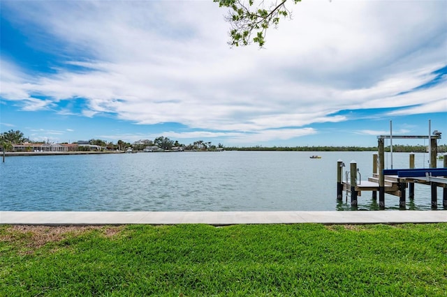 dock area featuring a yard and a water view