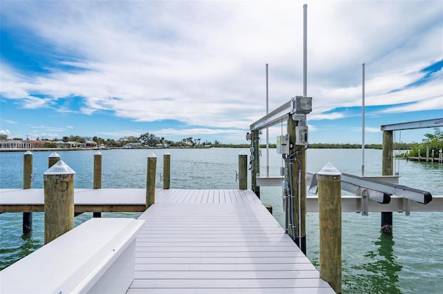 view of dock with a water view and boat lift