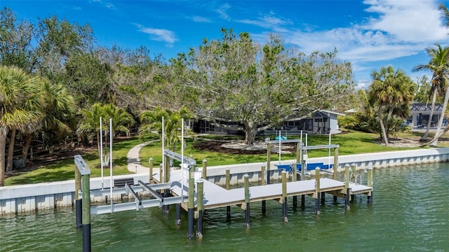 dock area with a water view and boat lift