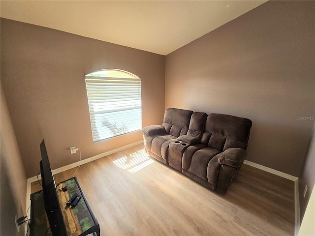 living room with wood finished floors and baseboards