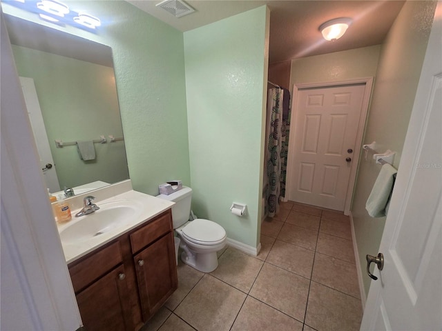 full bathroom with tile patterned flooring, toilet, vanity, visible vents, and baseboards