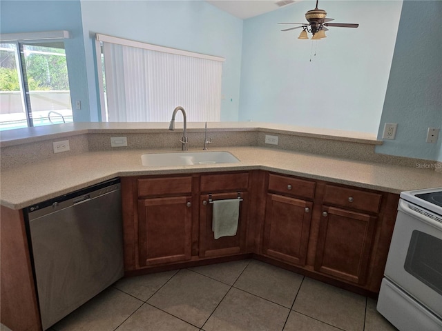 kitchen with white electric range oven, dishwasher, light countertops, a sink, and light tile patterned flooring