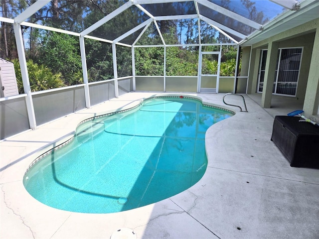 pool with a lanai and a patio