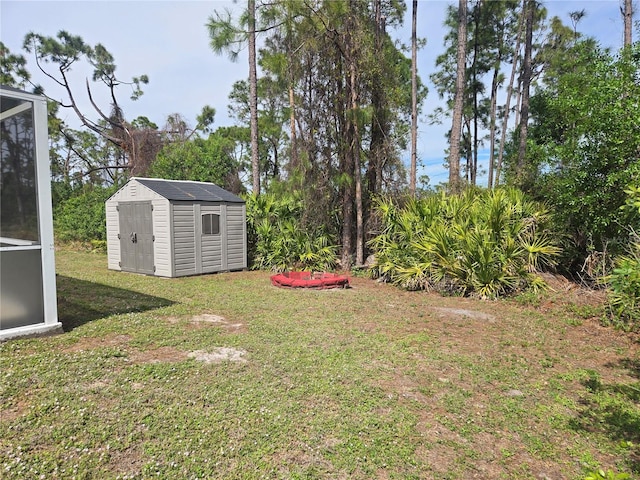 view of yard with an outbuilding and a storage shed