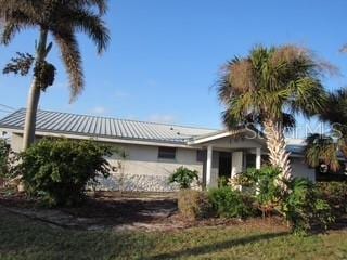 exterior space with metal roof and a standing seam roof