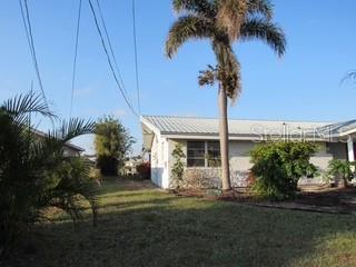 view of property exterior with a yard