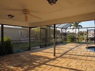 view of patio / terrace with a lanai and a ceiling fan