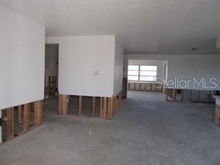 spare room with concrete flooring