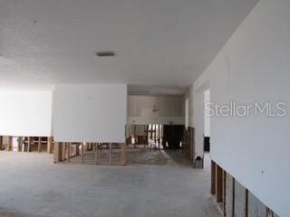 interior space featuring visible vents and concrete floors