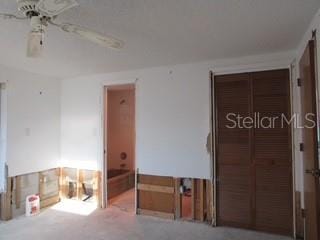 empty room featuring ceiling fan