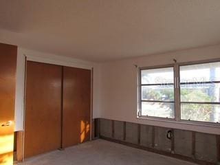 unfurnished bedroom with a closet