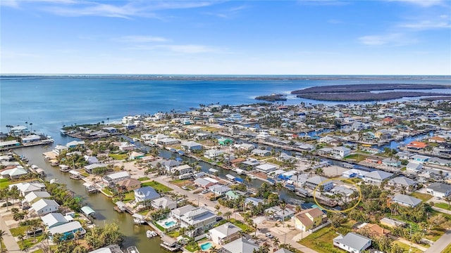 bird's eye view featuring a water view and a residential view