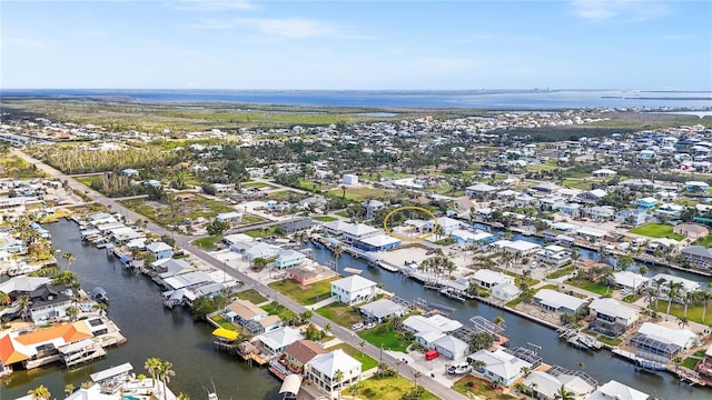 drone / aerial view with a residential view and a water view