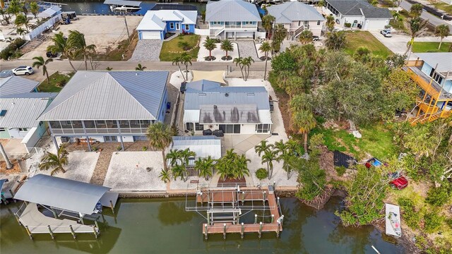 aerial view featuring a water view and a residential view