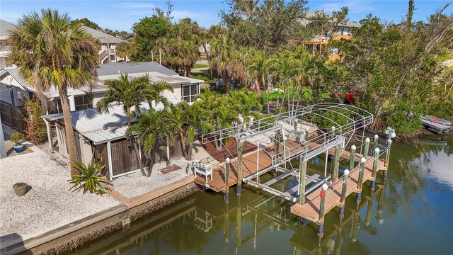 exterior space featuring a water view and boat lift