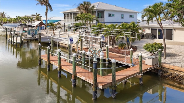 dock area featuring a water view and boat lift