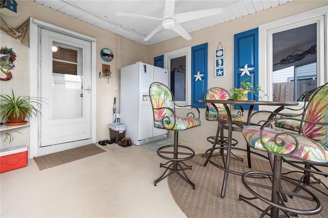 interior space with ceiling fan and electric panel