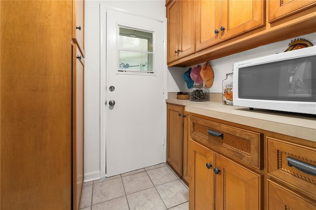 interior space featuring light tile patterned flooring