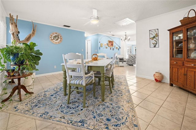 dining area with light tile patterned floors, baseboards, and crown molding