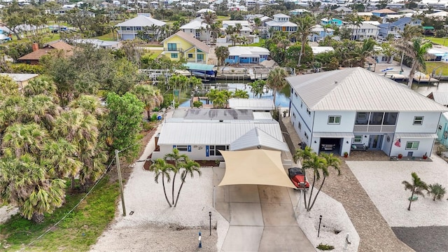 aerial view with a residential view and a water view