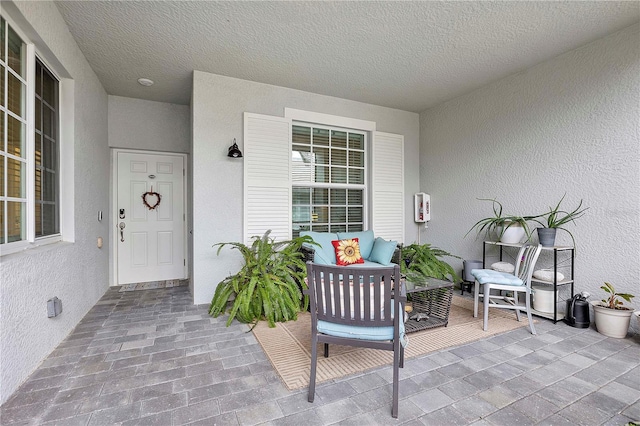 doorway to property with stucco siding