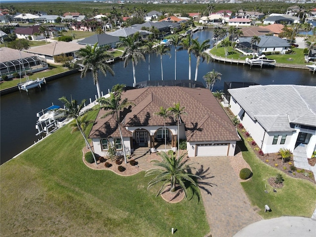 aerial view with a water view and a residential view