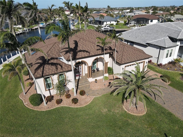 bird's eye view with a residential view and a water view