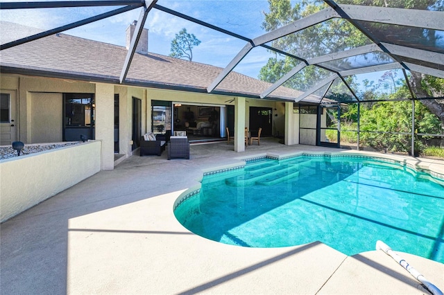 pool featuring a lanai and a patio area