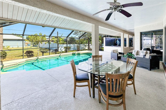 view of swimming pool with glass enclosure, a patio area, a fenced backyard, and an outdoor living space