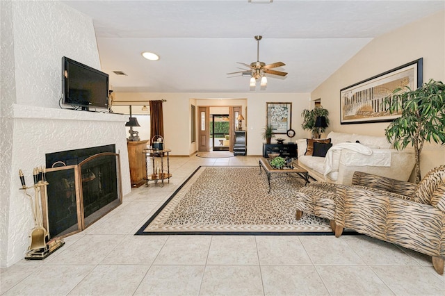 tiled living room with a fireplace, lofted ceiling, recessed lighting, visible vents, and ceiling fan