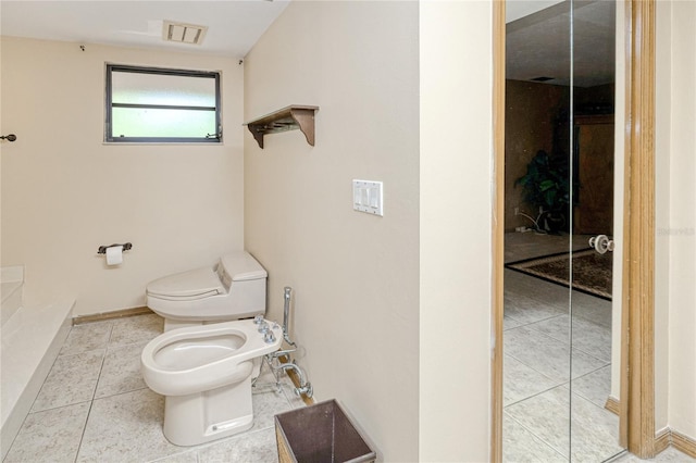 full bathroom with tile patterned flooring, toilet, visible vents, baseboards, and a bidet