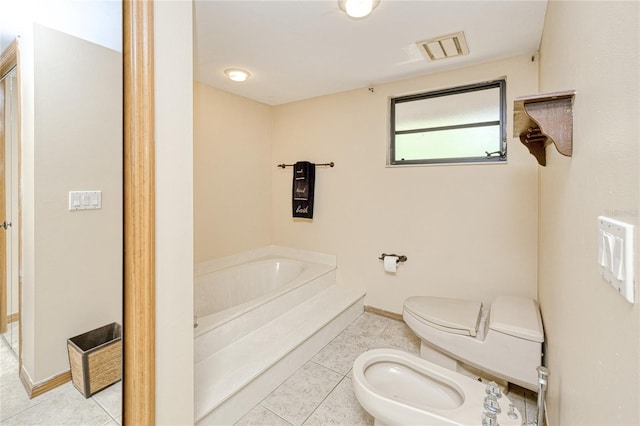 full bathroom featuring tile patterned flooring, a bidet, a garden tub, and toilet