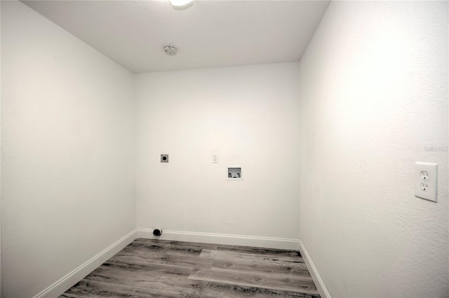 laundry room with laundry area, baseboards, wood finished floors, hookup for a washing machine, and electric dryer hookup