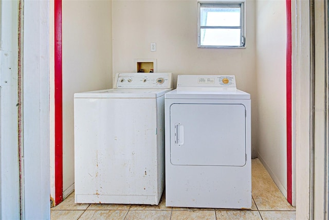 washroom featuring laundry area, light tile patterned flooring, and independent washer and dryer