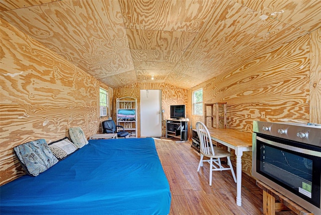 bedroom featuring wood ceiling, vaulted ceiling, and wood finished floors