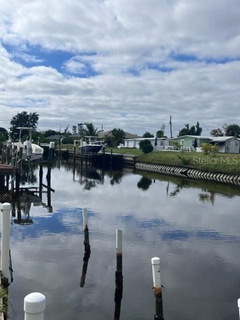 view of water feature with a dock and boat lift