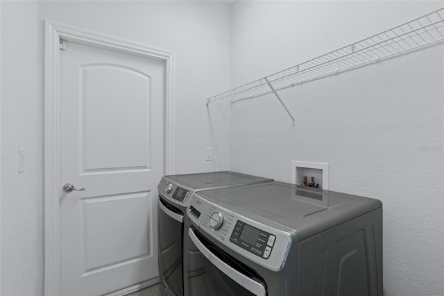 clothes washing area with laundry area and washing machine and dryer