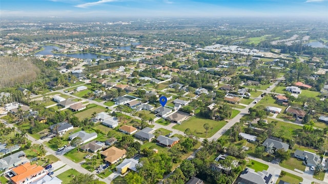 bird's eye view featuring a water view and a residential view