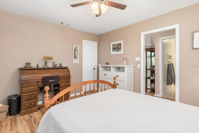 bedroom featuring visible vents, light wood-type flooring, and ceiling fan