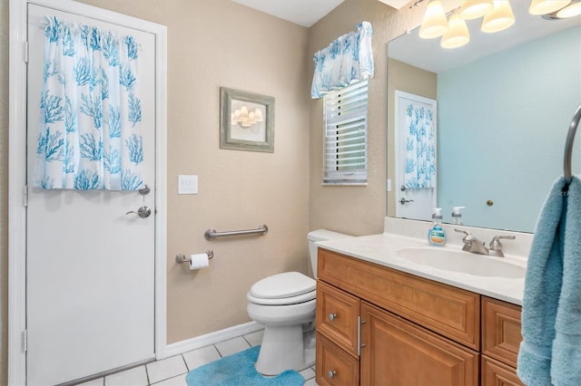 bathroom with toilet, an inviting chandelier, tile patterned flooring, baseboards, and vanity