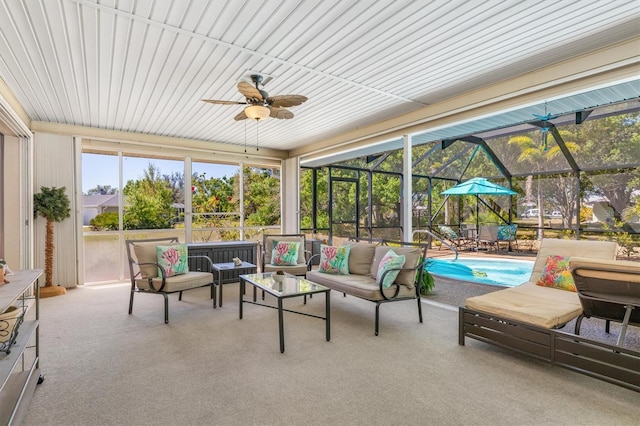 sunroom with a ceiling fan