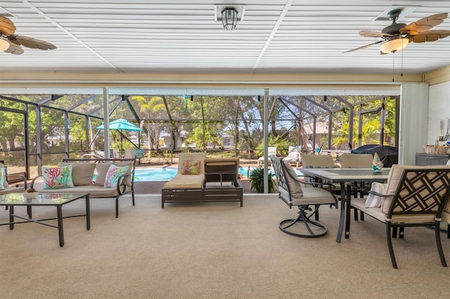 sunroom / solarium featuring ceiling fan