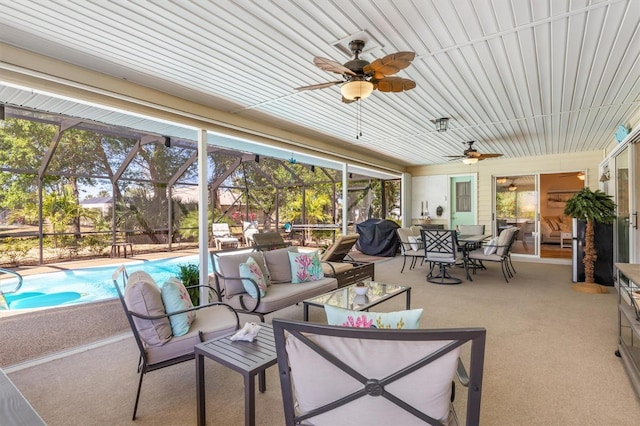 view of patio / terrace featuring glass enclosure, an outdoor living space, outdoor dining area, an outdoor pool, and ceiling fan